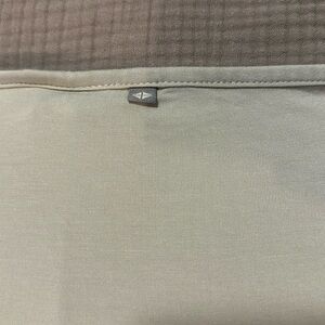 KyteBABY swaddle blanket in a very light green.